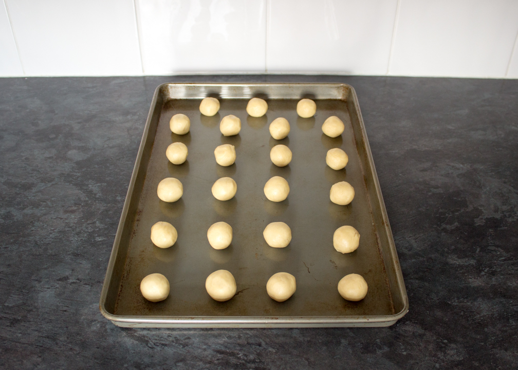 Cookie dough balls on a baking tray