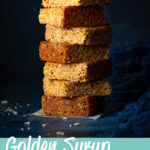 7 bars of golden syrup flapjack in a stack. A text overlay says 'golden syrup flapjack'