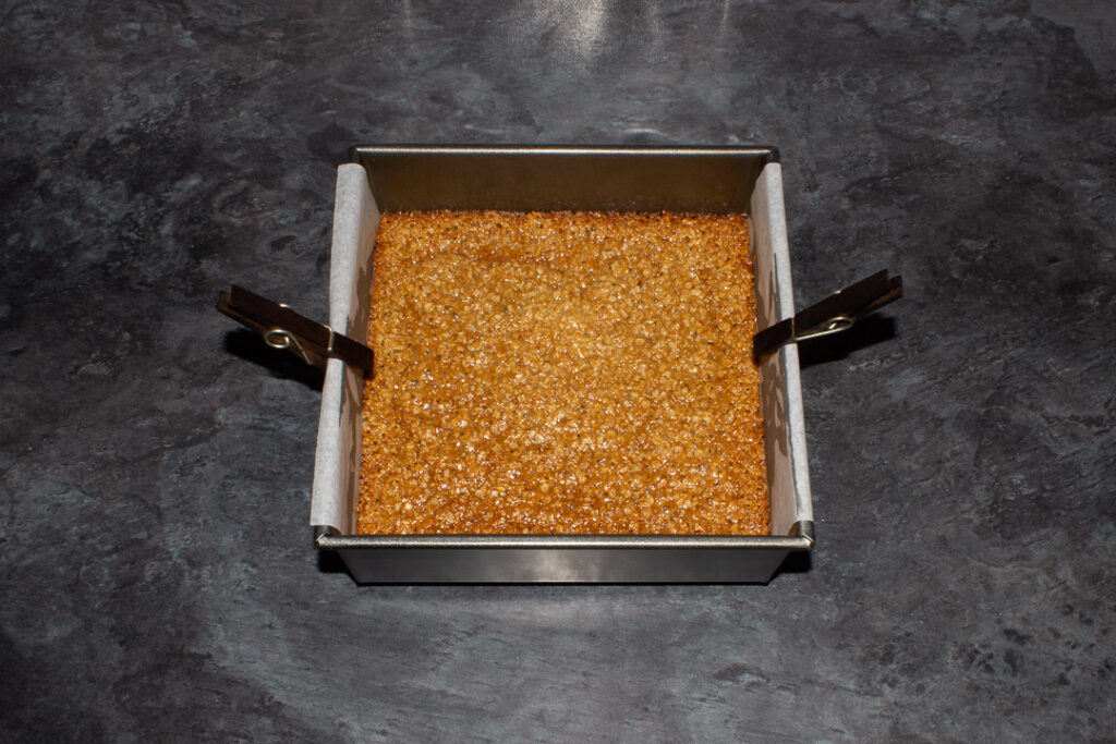 Baked chewy flapjack in a square tin
