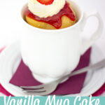 Vanilla mug cake in a mug topped with strawberries and sweetened cream. A text overlay says 'Vanilla mug cake with strawberries and cream'.