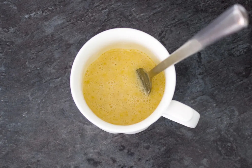 Melted butter, egg, milk and vanilla mixed together in a mug