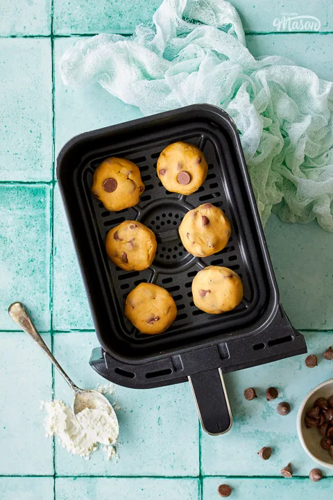 Cookie dough balls in an air fryer drawer