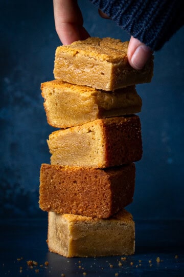 Someone taking the top blondie off a stack of 5