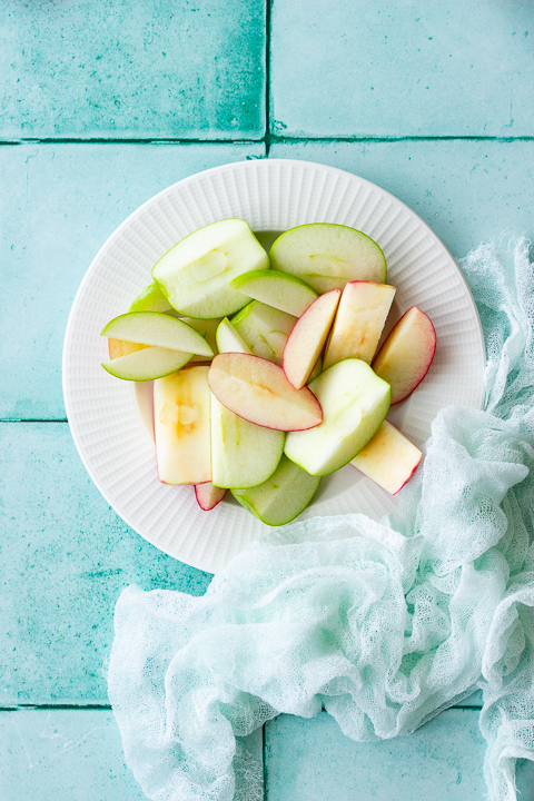 Sliced apples on a white plate