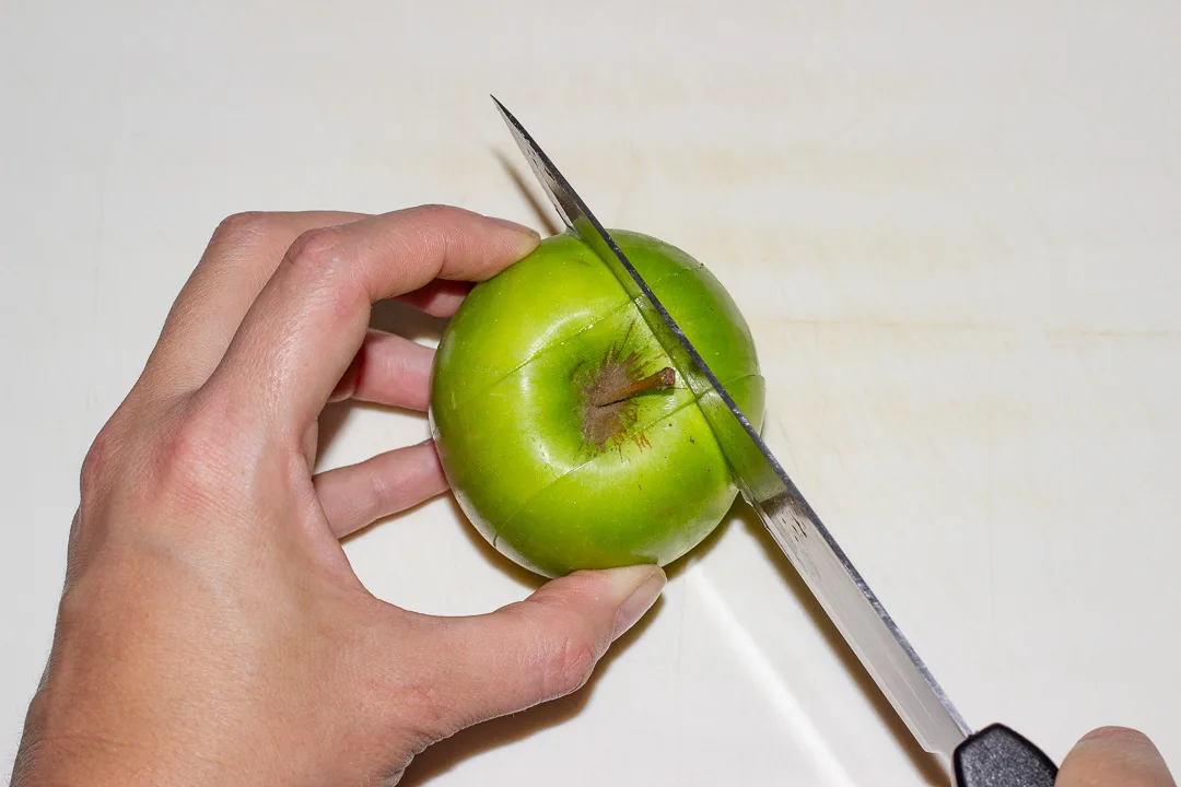 An apple with 3 cuts
