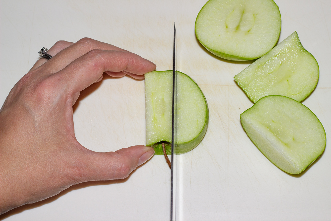 The core being removed from an apple