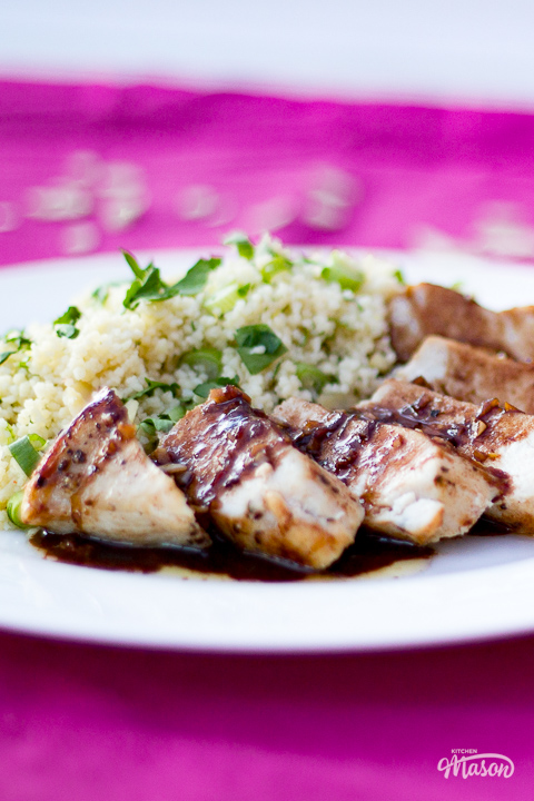 Balsamic chicken on a plate with herby couscous