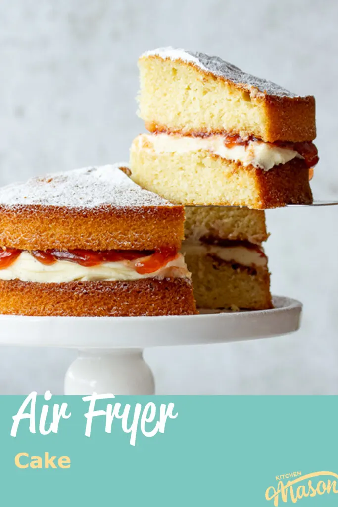 Close up of a slice of air fryer sponge cake being held up. A text overlay says 'Air Fryer Cake'