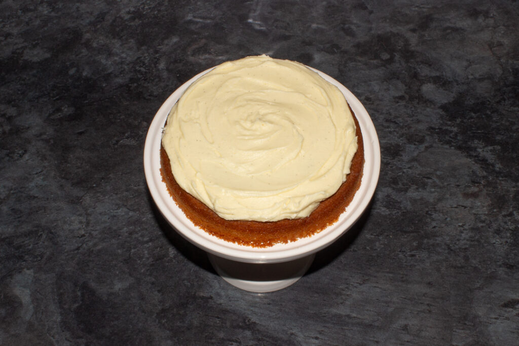 Buttercream icing spread on a cake