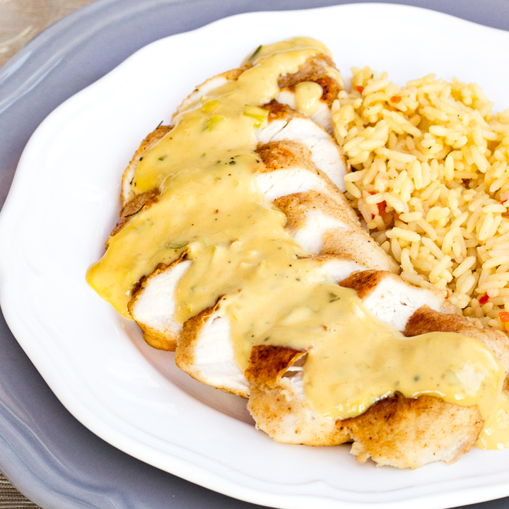Creamy honey mustard chicken on a plate with rice