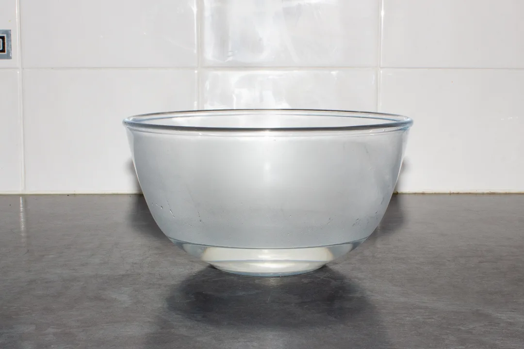 A glass bowl with boiling water in it