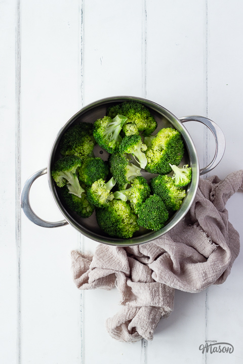 Steamed broccoli in a steamer basket