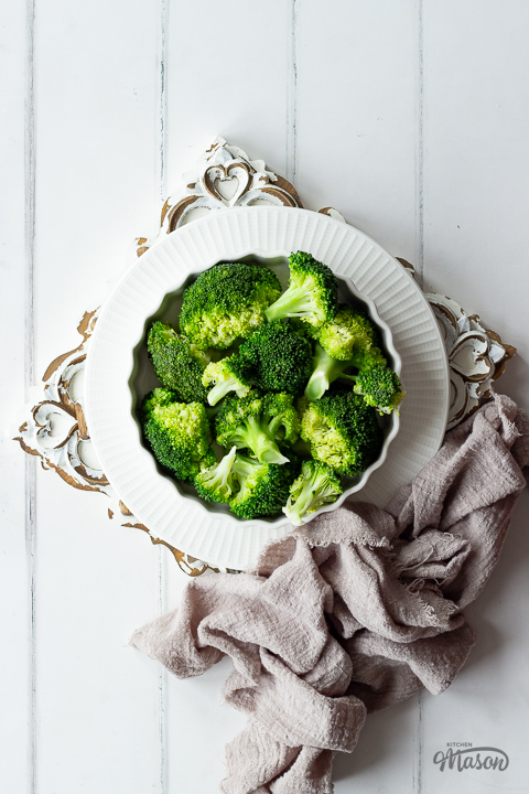 Steamed broccoli in a white dish