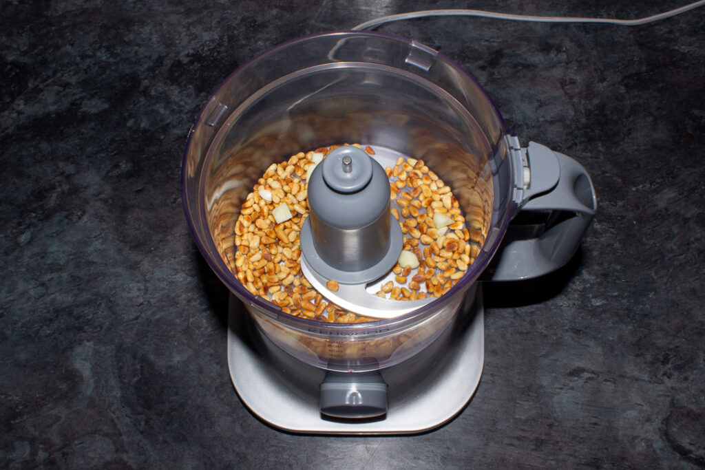Toasted pine nuts and garlic in a food processor