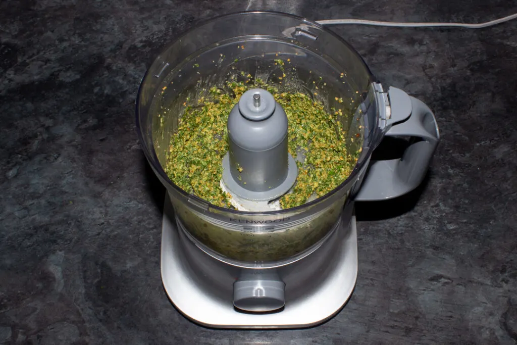 Pesto base ingredients in a food processor