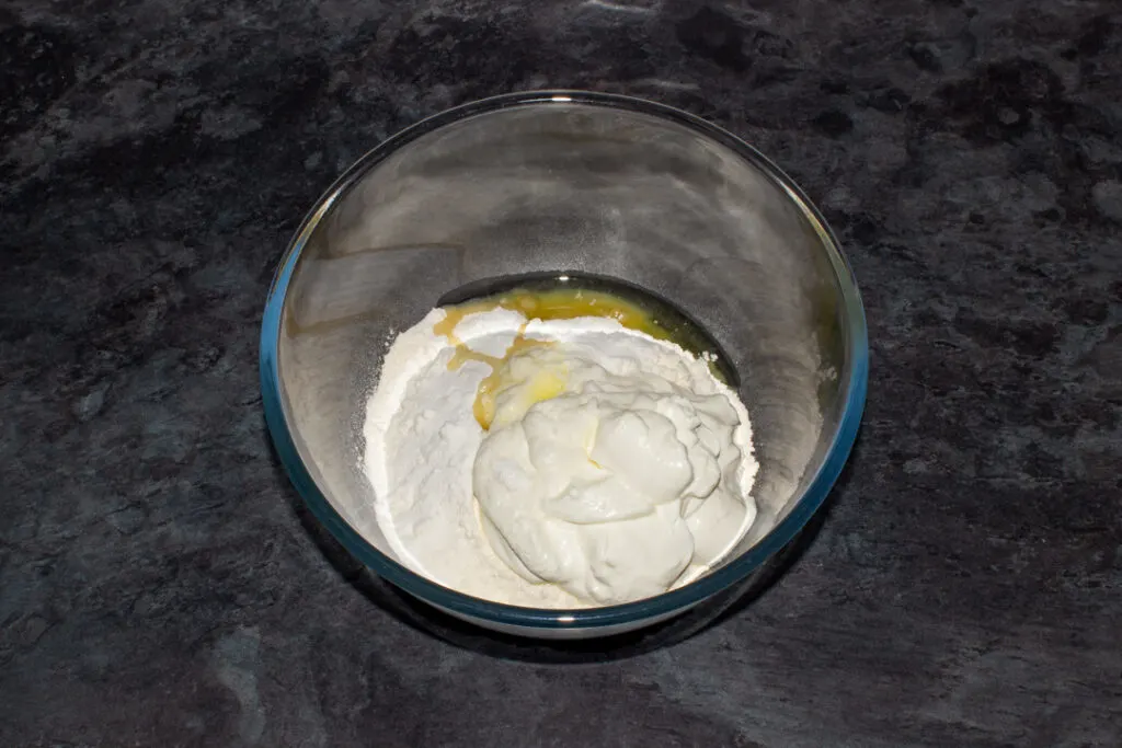 Flour, Greek yoghurt, salt, baking powder and olive oil in a mixing bowl