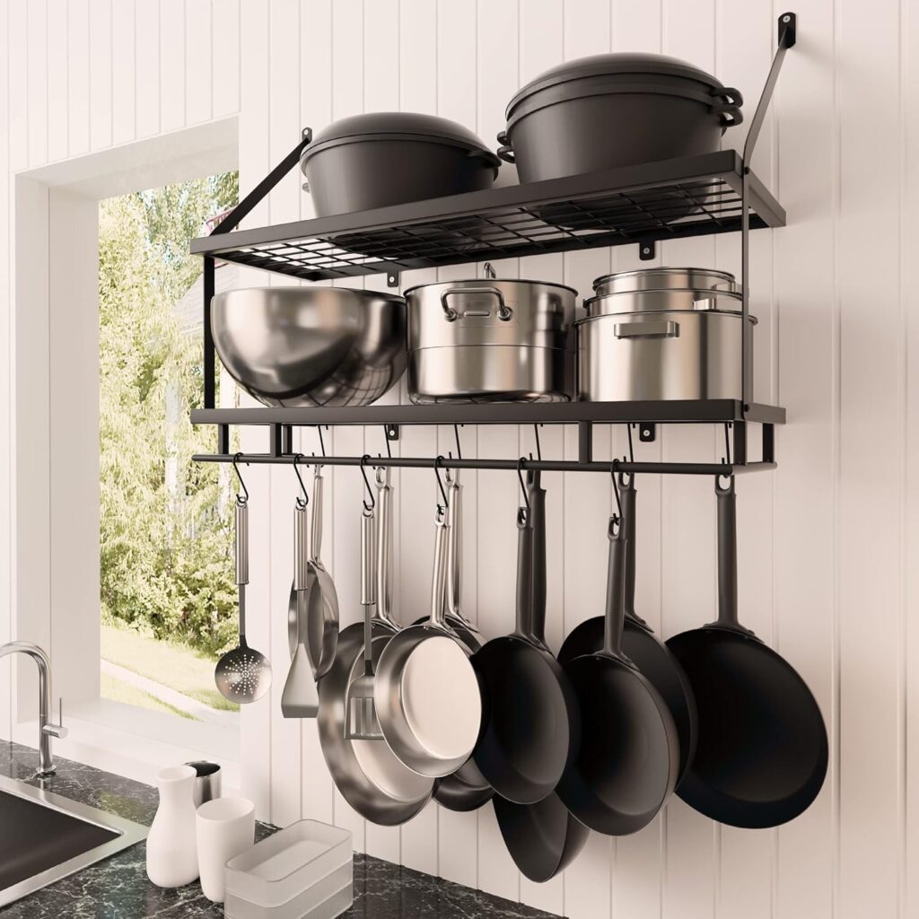 A wall mounted hanger and shelving unit with pots and pans