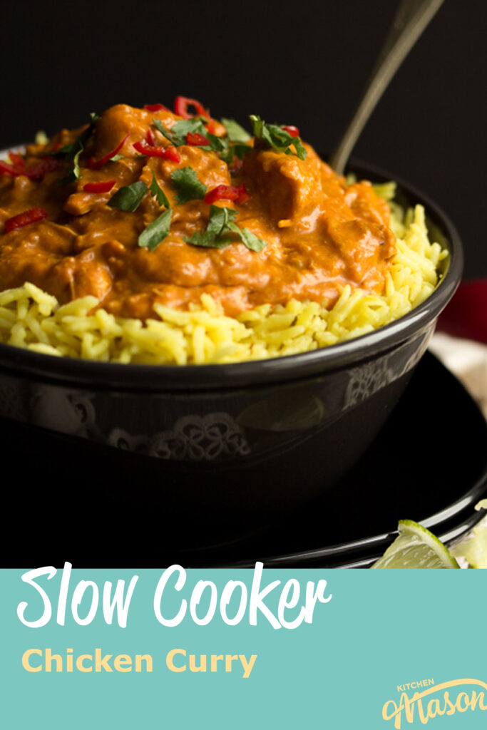 A bowl of slow cooker chicken curry with rice.