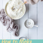 Someone stirring baking powder into plain flour. A text overlay says 'how to make self raising flour'.