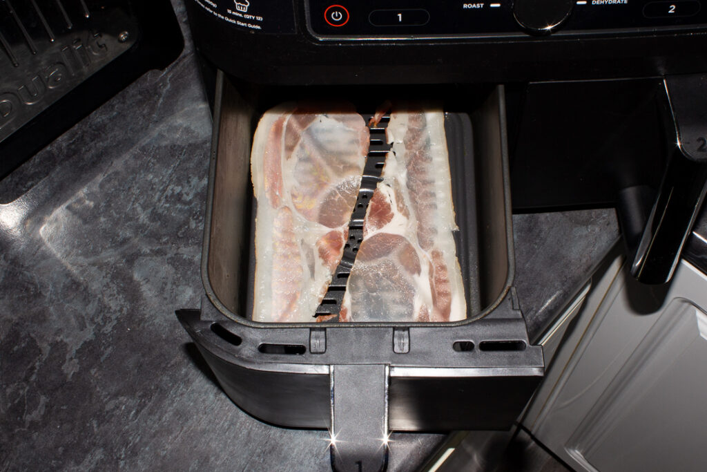 Uncooked back bacon in an air fryer