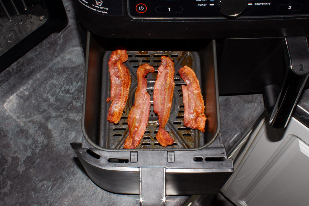 Fully cooked streaky bacon in an air fryer