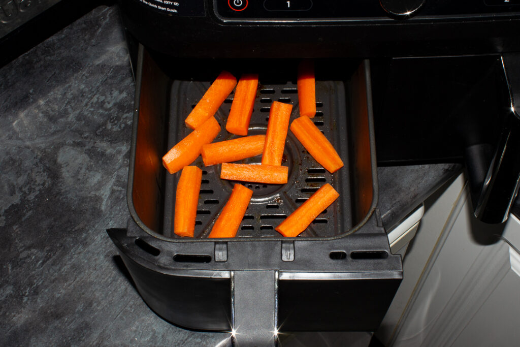 Prepared carrot batons in an air fryer