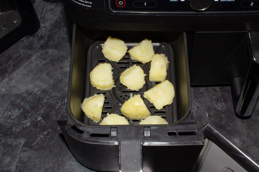 prepared par boiled potatoes in an air fryer drawer