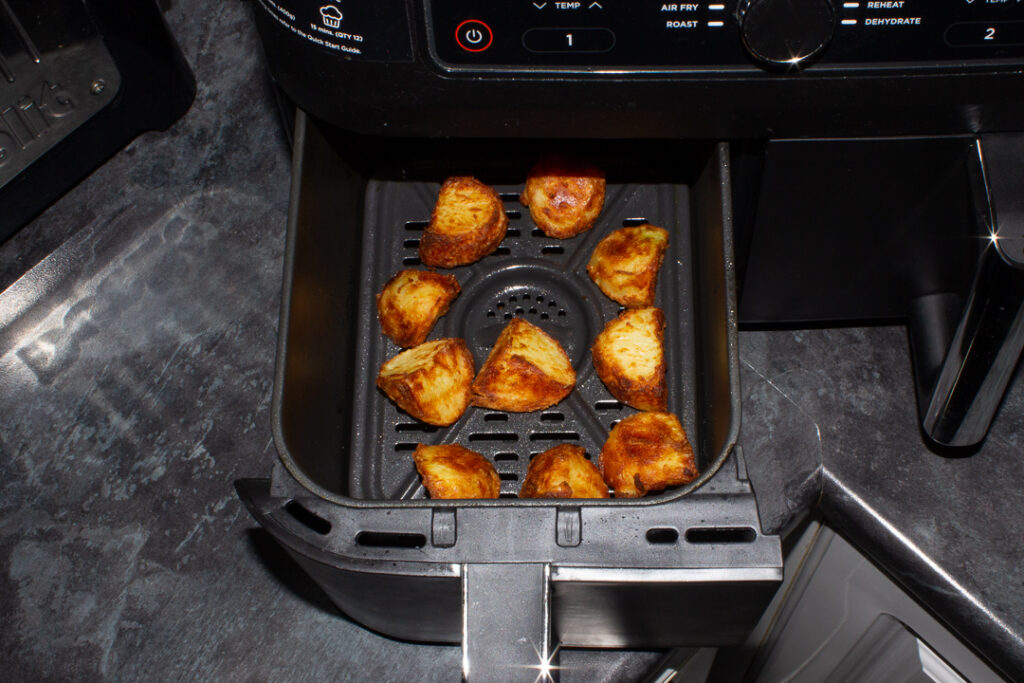 Air fryer roast potatoes that have been par boiled in an air fryer drawer