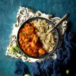 Close up of air fryer chicken thigh curry on a plate