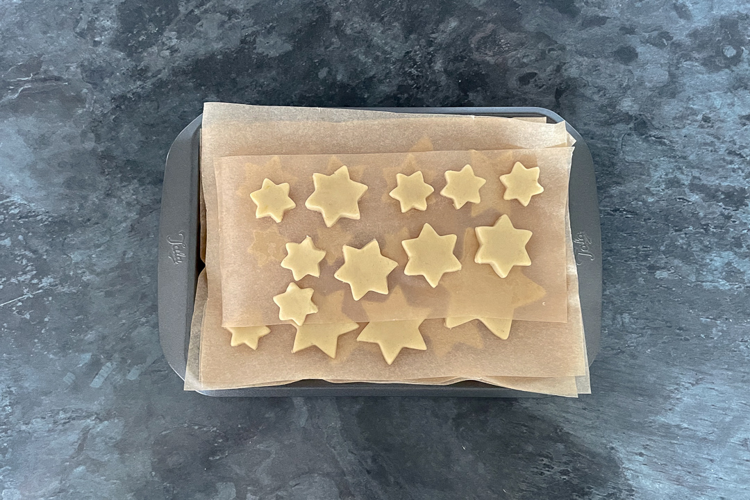 cookie shapes on a small baking tray
