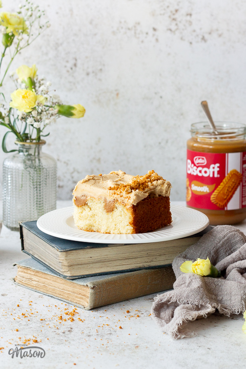 A slice of Biscoff tray bake cake on a plate