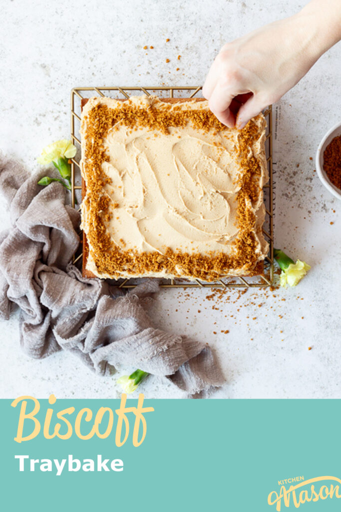 Biscoff biscuit crumbs sprinkled over a Biscoff traybake cake. A text overlay says 'Biscoff traybake'