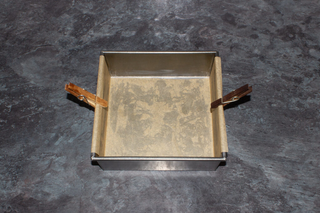 A lined square baking tin.