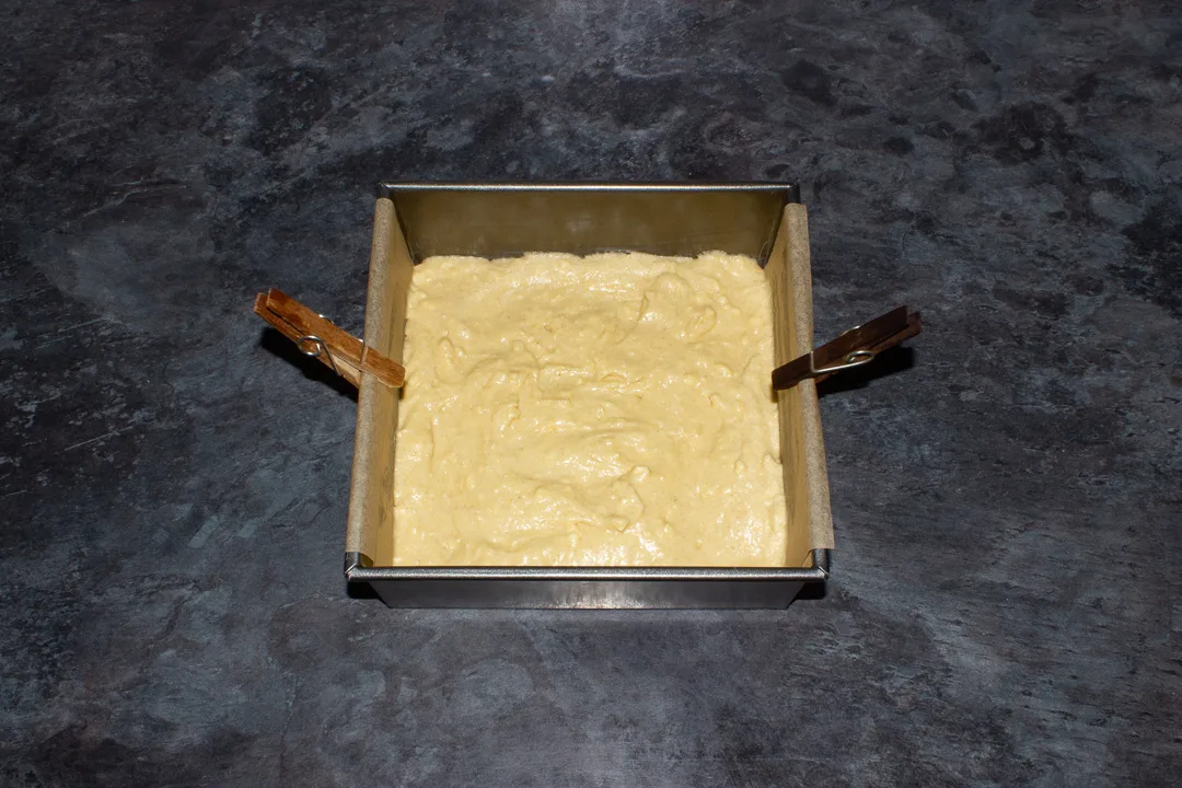 Cake batter in a lined tin