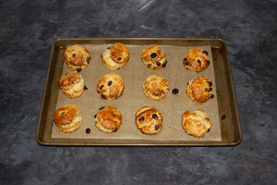 Freshly baked fruit scones on a baking tray