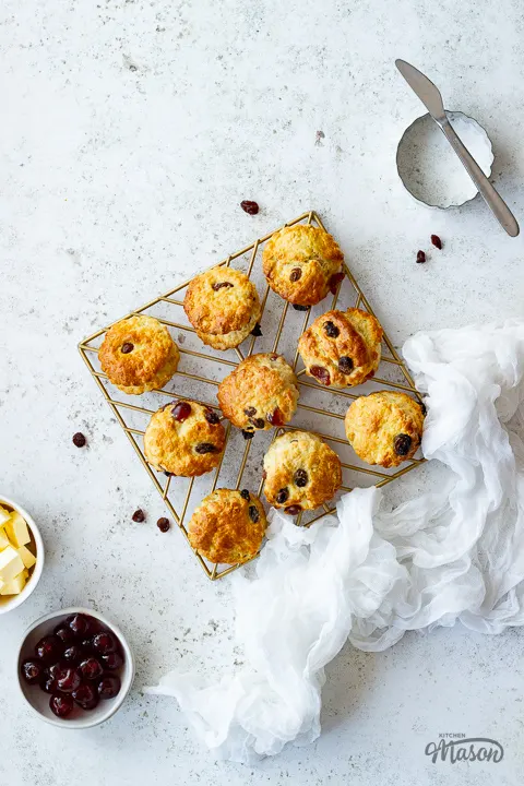 Fruit scones on a gold wire rack