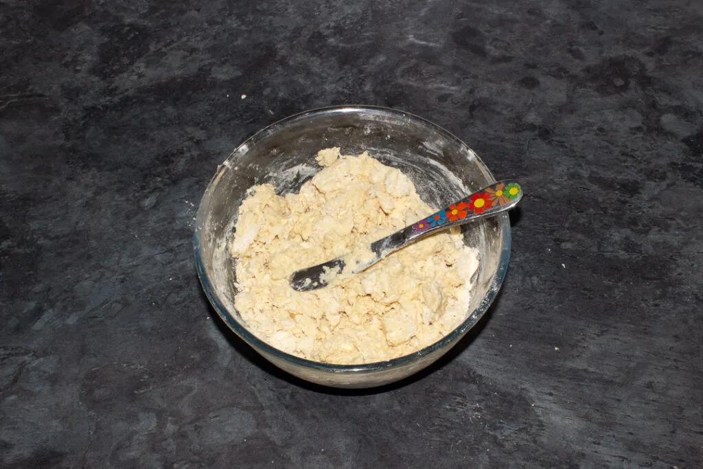 Rough fruit scones dough in a mixing bowl