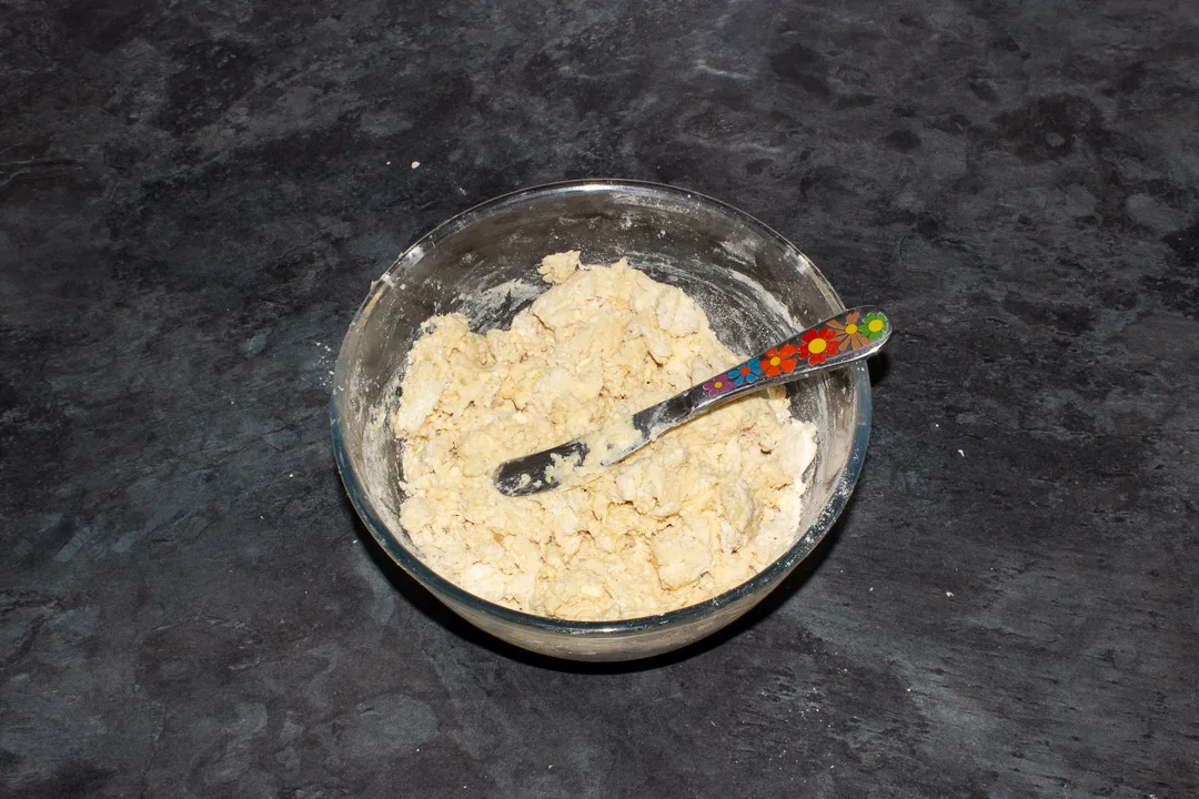 Rough fruit scones dough in a mixing bowl