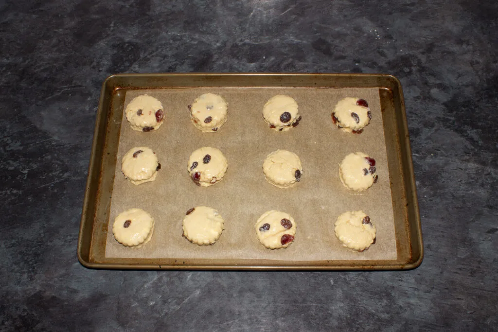 Egg washed fruit scones on a baking tray