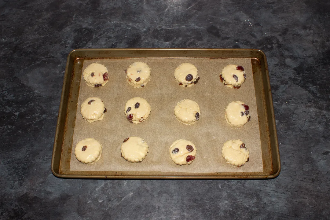 Egg washed fruit scones on a baking tray