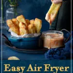 Someone dunking a halloumi fry into a dip. A text overlay says 'easy air fryer halloumi fries'