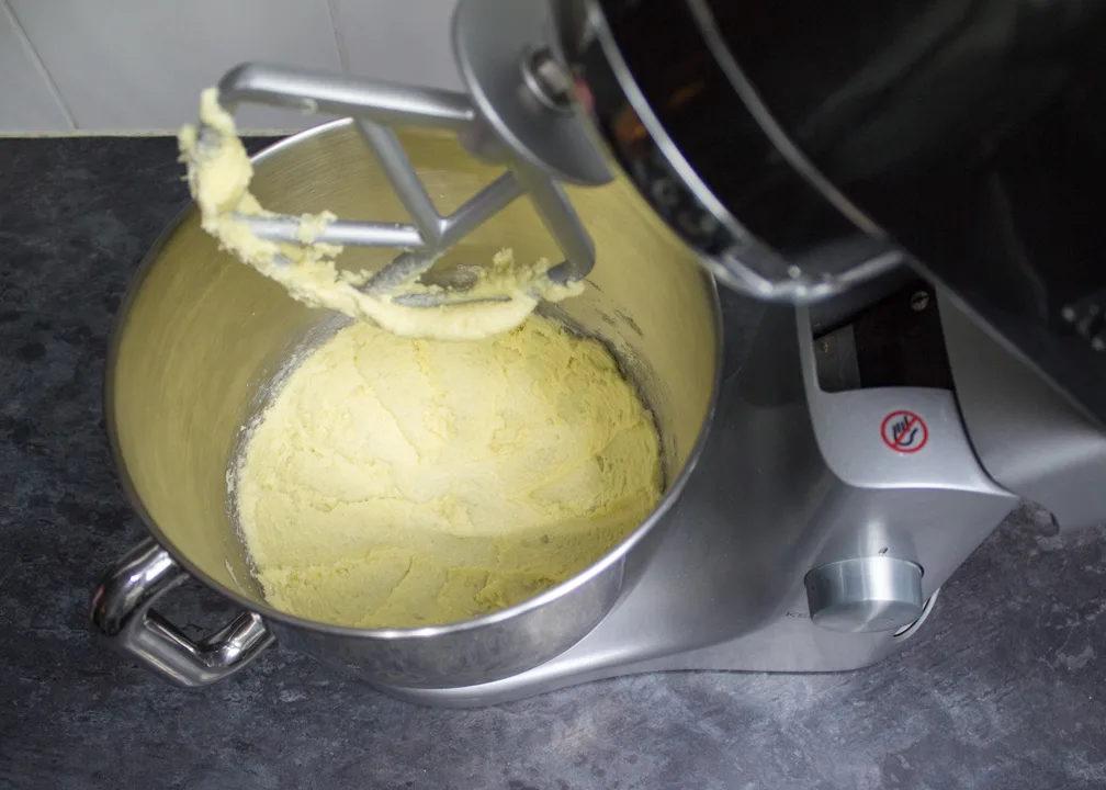 Creamed butter and sugar in the bowl of an electric stand mixer.