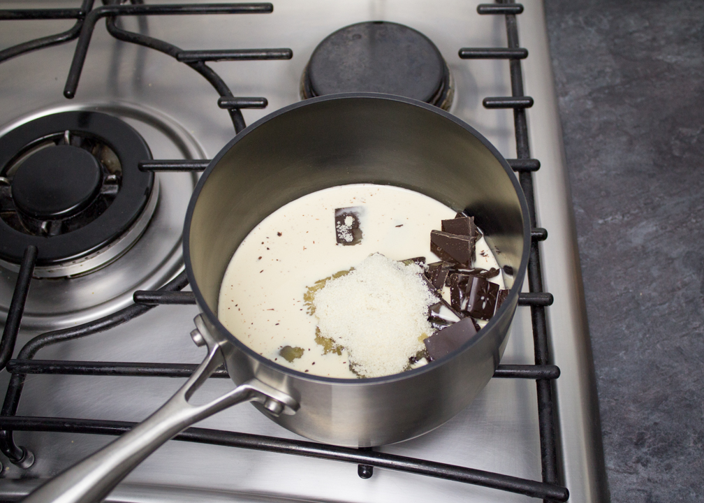 Dark chocolate, evaporated milk and sugar in a saucepan over a low heat.