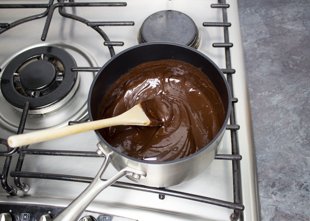 Chocolate sauce with added butter, vanilla and salt, in a saucepan over a low heat.