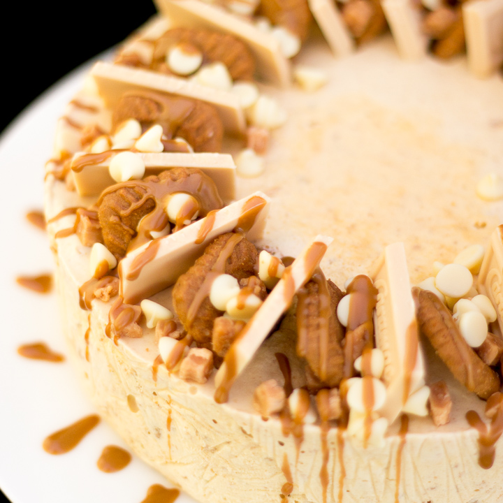 A Biscoff ice cream cake on a white serving plate.