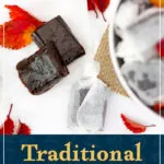 A white bowl filled with wrapped bonfire toffee sweets. Two unwrapped bonfire toffees and red orange leaves are to the side of it. A text overlay says "Traditional Bonfire Toffee".