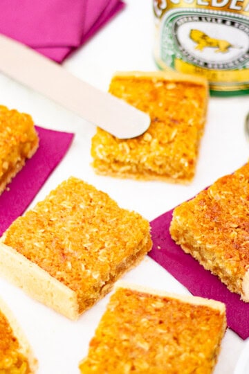 Treacle tart bars on a worktop.
