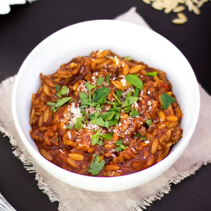 A bowl of orzo bolognese.