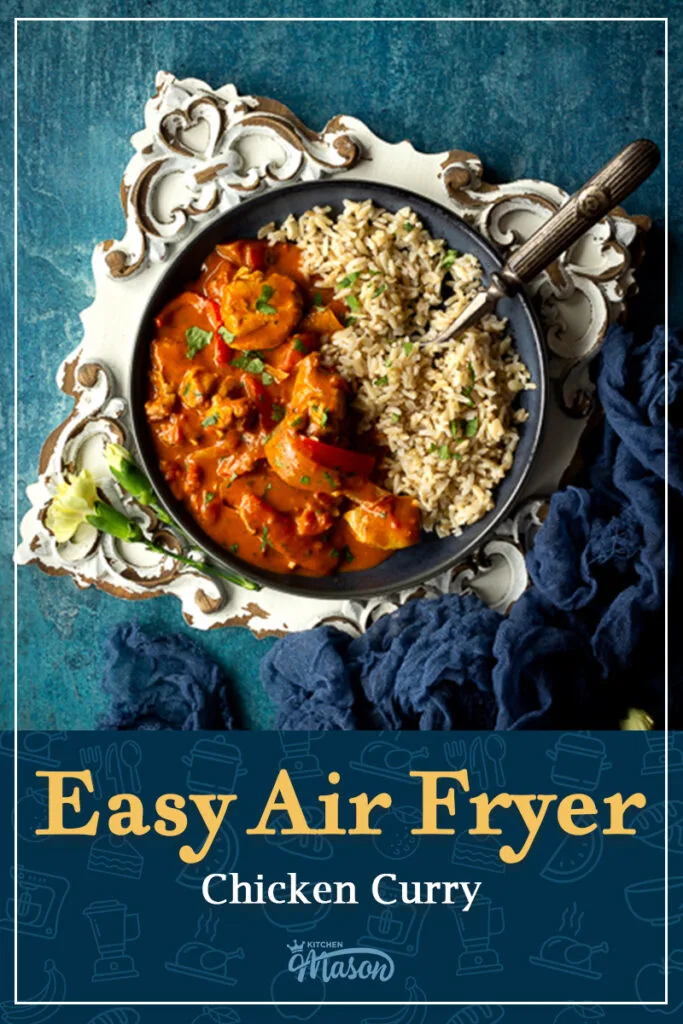 Close up of air fryer chicken thigh curry on a plate. A text overlay says 'Air Fryer Chicken Curry'.