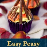 Bonfire cupcakes on beige fabric surrounded by red and orange leaves. A text overlay says "Easy peasy bonfire cupcakes recipe".